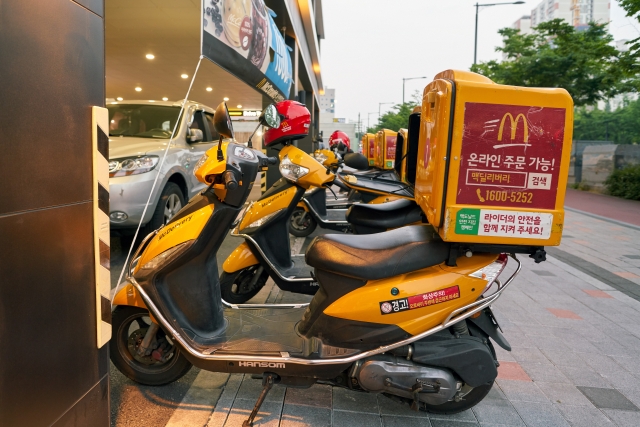 Mcdonald's delivery vehicles are seen in this stock photo. (123rf)