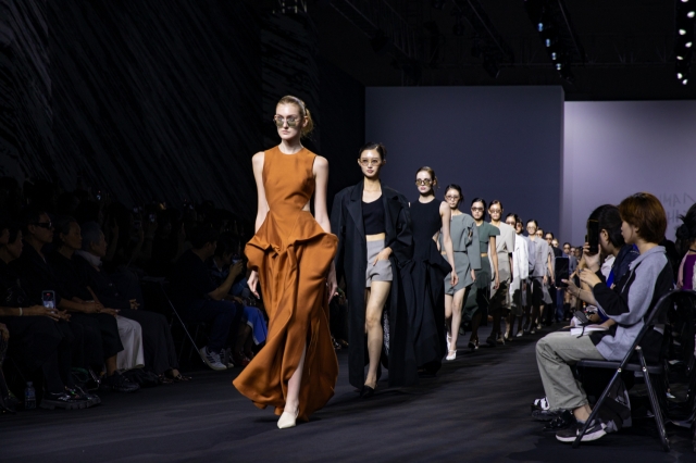 Models wear creations for Kumann Yhj as part of the spring-summer 2025 Seoul Fashion Week at Dongdaemun Design Plaza in Seoul on Tuesday. (Seoul City)