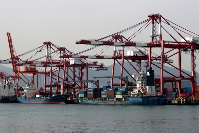 Shipping containers are stacked at the Busan Port. (Getty Images)