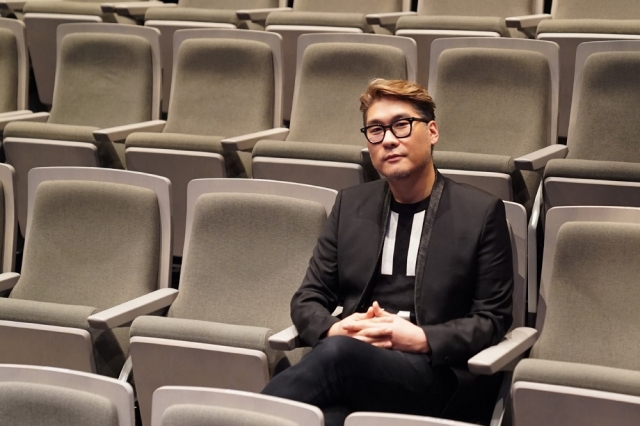 Yossef K. Junghan poses for a photo after an interview with The Korea Herald at the LG Arts Center in Seoul, in August. (Hwang Dong-hee/The Korea Herald)